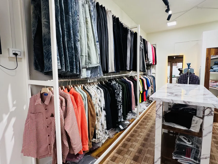 Branded shirts and jeans on display inside D Iconique