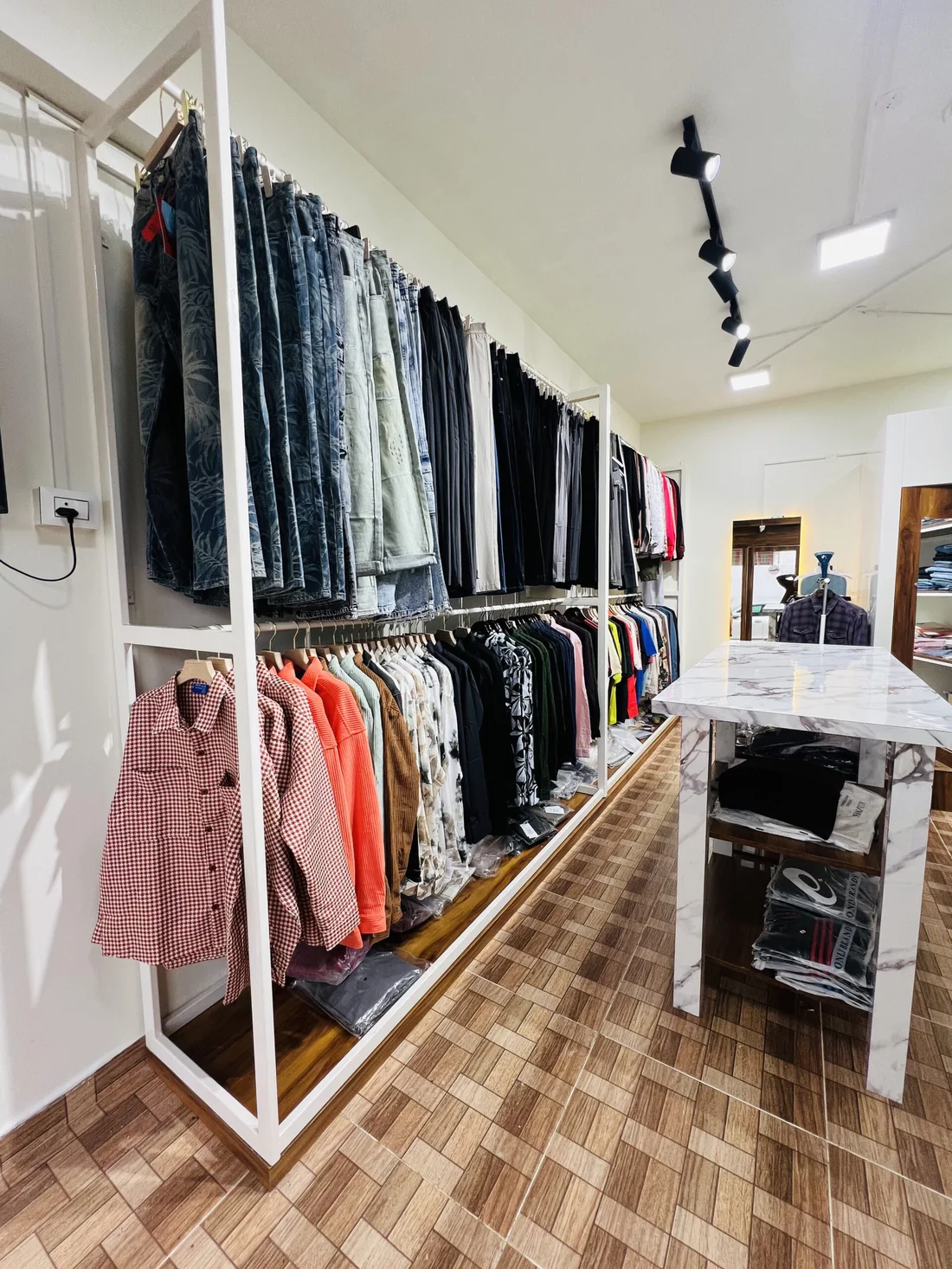 Inside the D Iconique showroom — branded men's wear on display